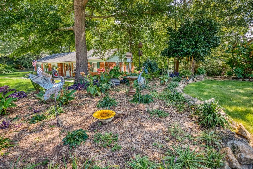 304 Edwards Street Monroe, GA 30655 - Photo 47 of 64 a view of a swimming pool with a house in the background