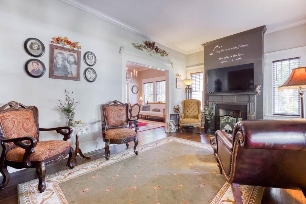 304 Edwards Street Monroe, GA 30655 - Photo 5 of 64 a living room with furniture and a fireplace