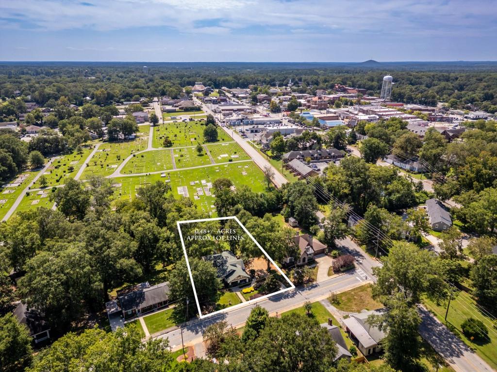304 Edwards Street Monroe, GA 30655 - Photo 61 of 64 an aerial view of residential houses with outdoor space