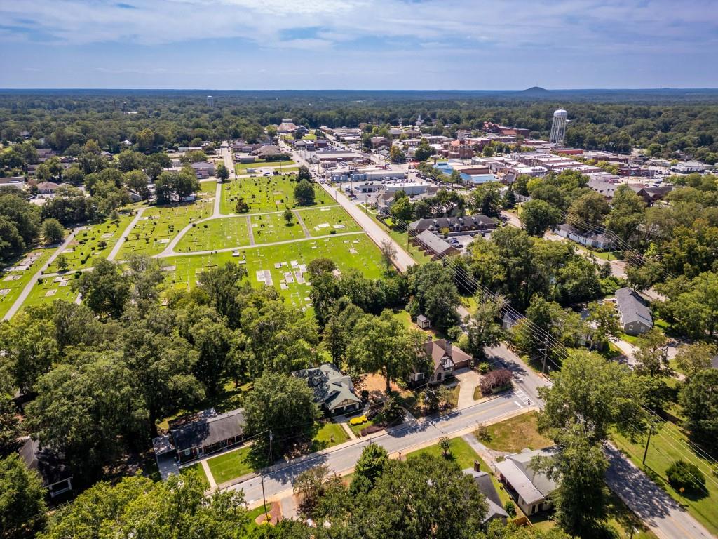 304 Edwards Street Monroe, GA 30655 - Photo 62 of 64 an aerial view of a residential houses with outdoor space and trees all around