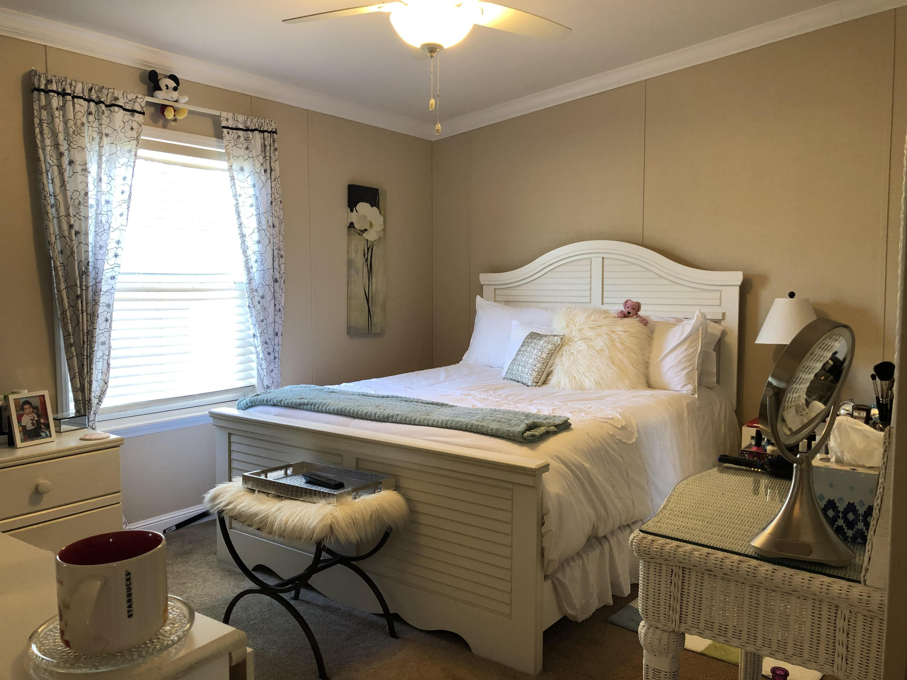 11907 Cove Place Boca Raton, FL 33428 - Photo 12 of 19 a bedroom with a bed and a chandelier