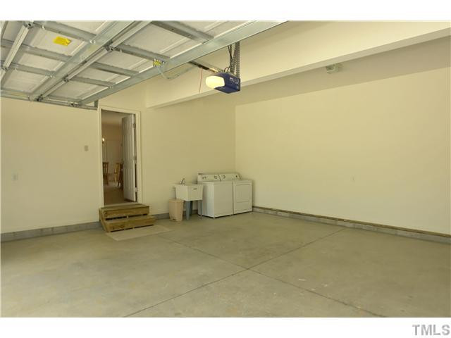119 West Quail Ridge Road Oxford, NC 27565 - Photo 16 of 21 Interior of the Garage area. This is currently also where the washer and dryer area is located. Above the garage is a large 384 SF floored room that could easily be converted into living area.