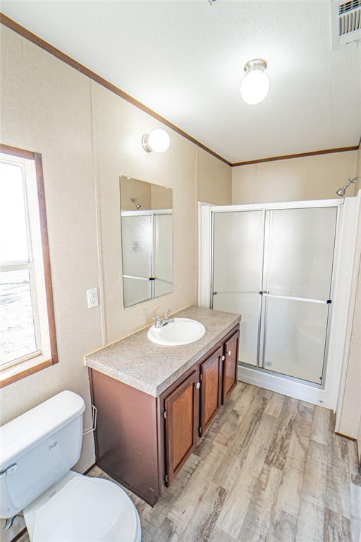 605 South Butte Street Breckenridge, TX 76424 - Photo 15 of 26 a bathroom with a sink and a mirror