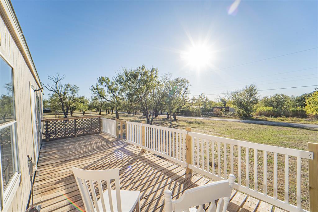 605 South Butte Street Breckenridge, TX 76424 - Photo 16 of 26 a view of a balcony with yard