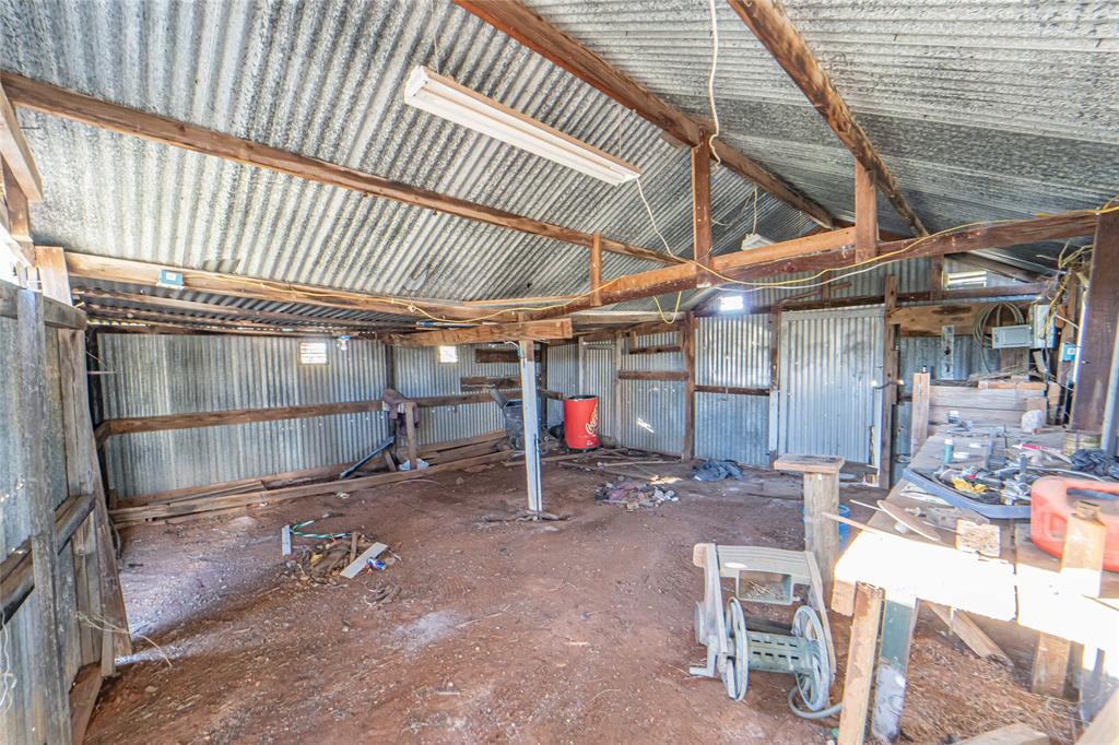 605 South Butte Street Breckenridge, TX 76424 - Photo 20 of 26 a view of a room with wooden shelves