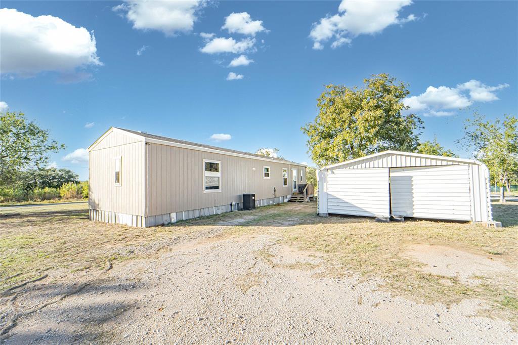 605 South Butte Street Breckenridge, TX 76424 - Photo 21 of 26 a view of a house with a snow in the yard