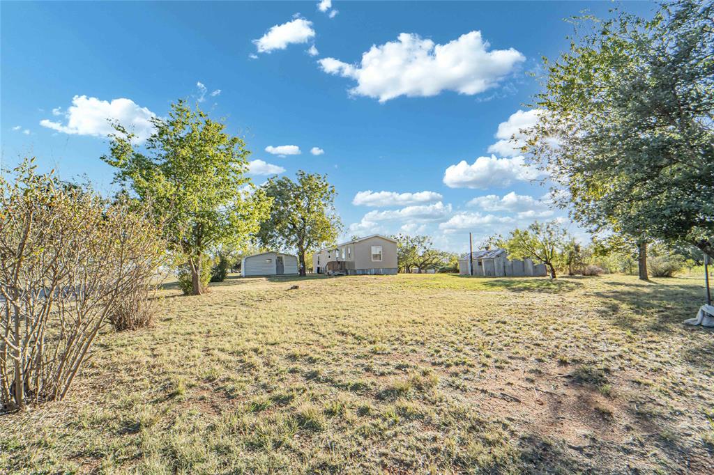 605 South Butte Street Breckenridge, TX 76424 - Photo 5 of 26 a view of a yard with an trees