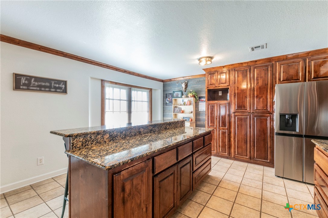 508 Straws Mill Road Gatesville, TX 76528 - Photo 7 of 26 Dining area with built-in cabinetry and natural light