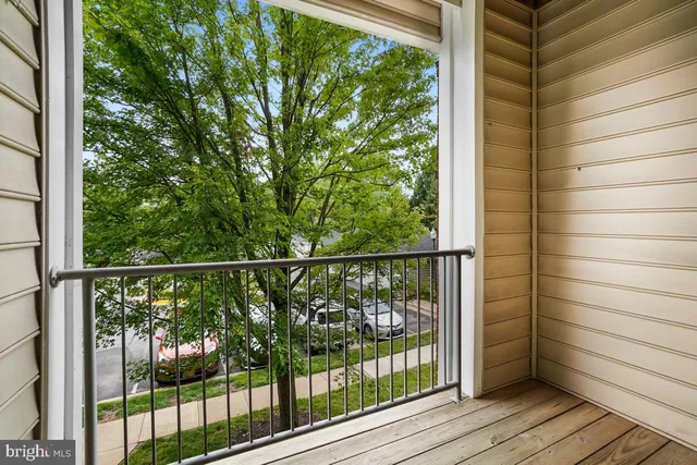 a view of a balcony with wooden floor
