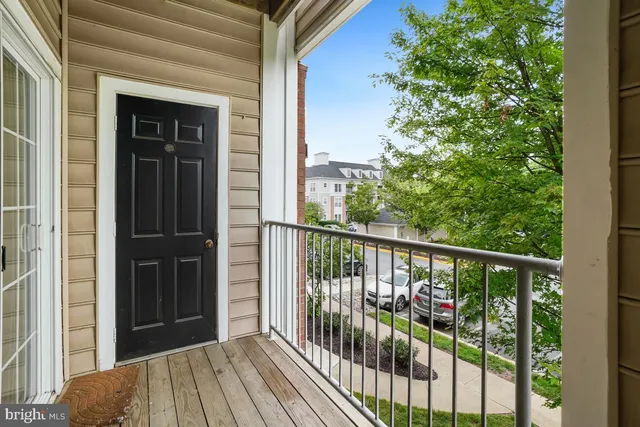 a view of a balcony with wooden floor