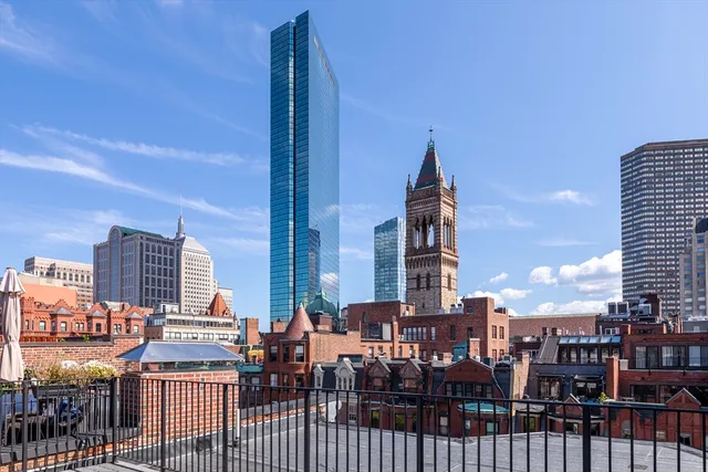 a kitchen with a refrigerator and a sink