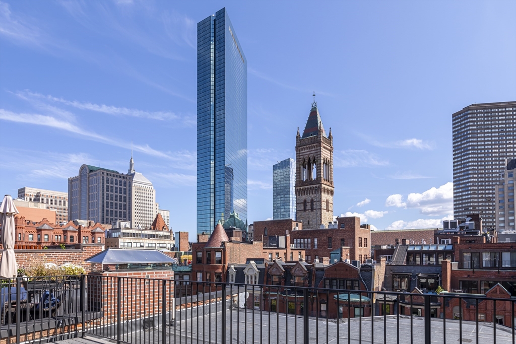 169 Newbury Street, Unit PH Boston, MA 02116 - Photo 19 of 25 a view of city with tall buildings