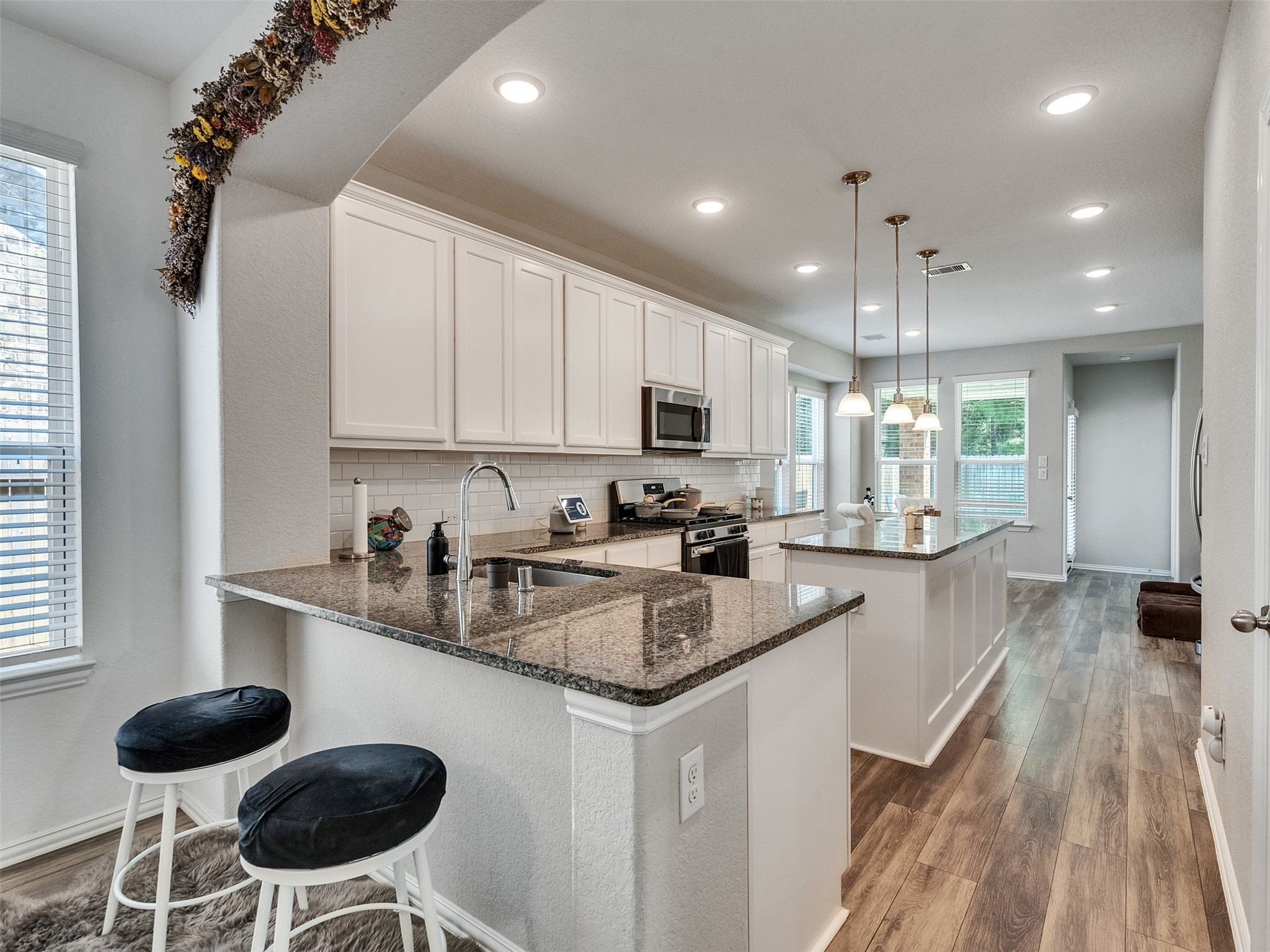 29859 Woodsons Edge Way Spring, TX 77386 - Photo 12 of 36 Breakfast bar with a great view of the Kitchen and Breakfast room