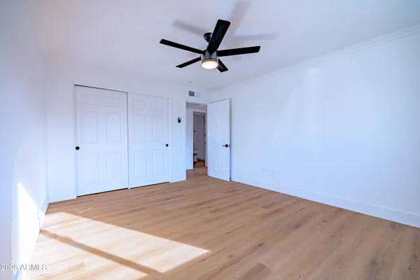 a very nice looking room with a ceiling fan