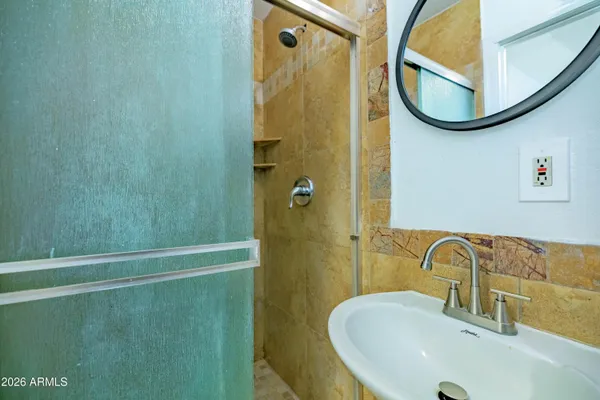 a bathroom with a sink and a mirror