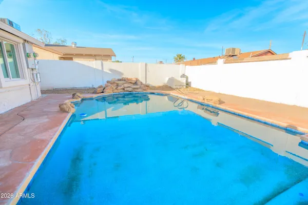a view of a swimming pool with an ocean view