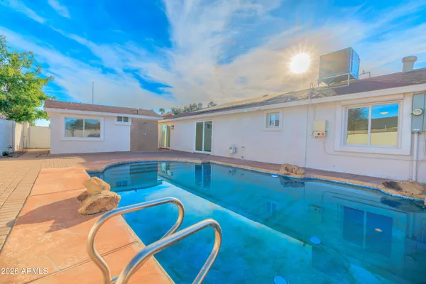 a view of a house with swimming pool