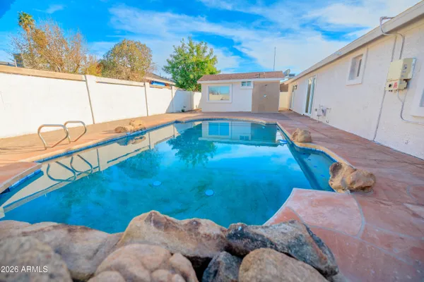 a view of swimming pool with patio