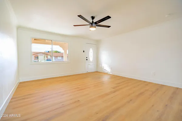 a view of an empty room with a window