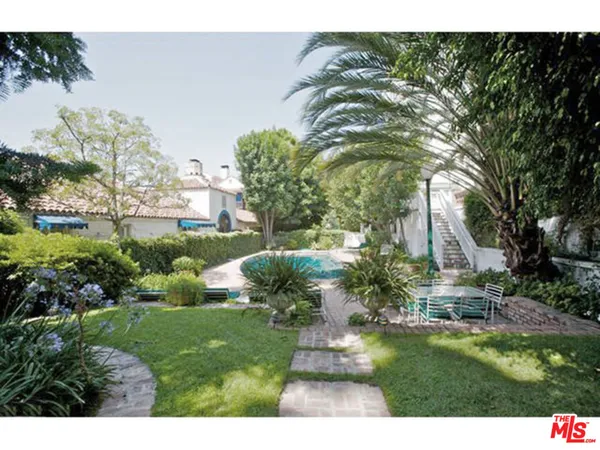 a view of a garden with a fountain