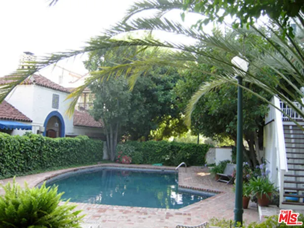 a view of a swimming pool with a patio