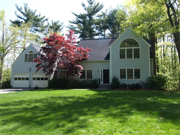 108 West Berlin Road Bolton, MA 01740 - Photo 1 of 25 a front view of house with yard and green space