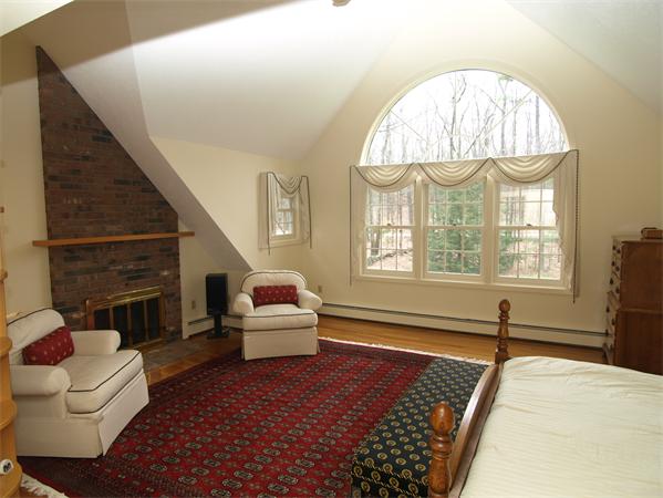 108 West Berlin Road Bolton, MA 01740 - Photo 13 of 25 a living room with furniture and a fireplace