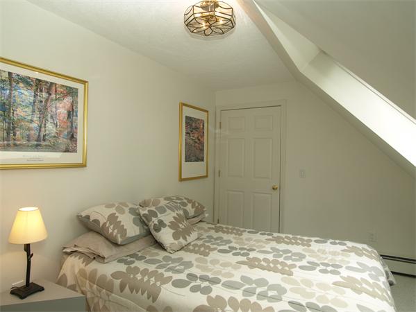 108 West Berlin Road Bolton, MA 01740 - Photo 19 of 25 a bedroom with a bed and a lamp on table