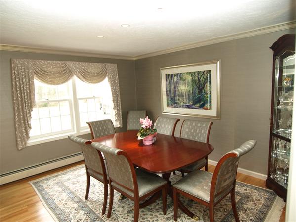 108 West Berlin Road Bolton, MA 01740 - Photo 3 of 25 a view of a dining room with furniture a rug and wooden floor