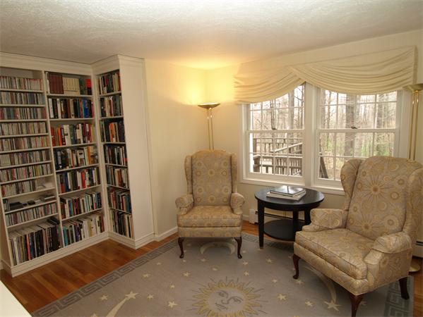 108 West Berlin Road Bolton, MA 01740 - Photo 8 of 25 a living room with furniture and a book shelf