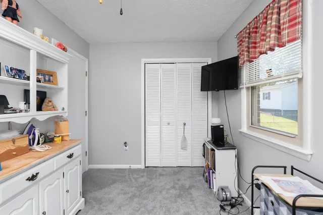 a view of a kitchen with cabinets and wooden floor