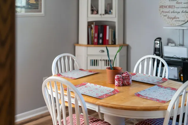 a bedroom with furniture and a chair