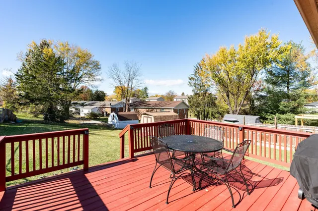 a view of a chairs and table on the deck