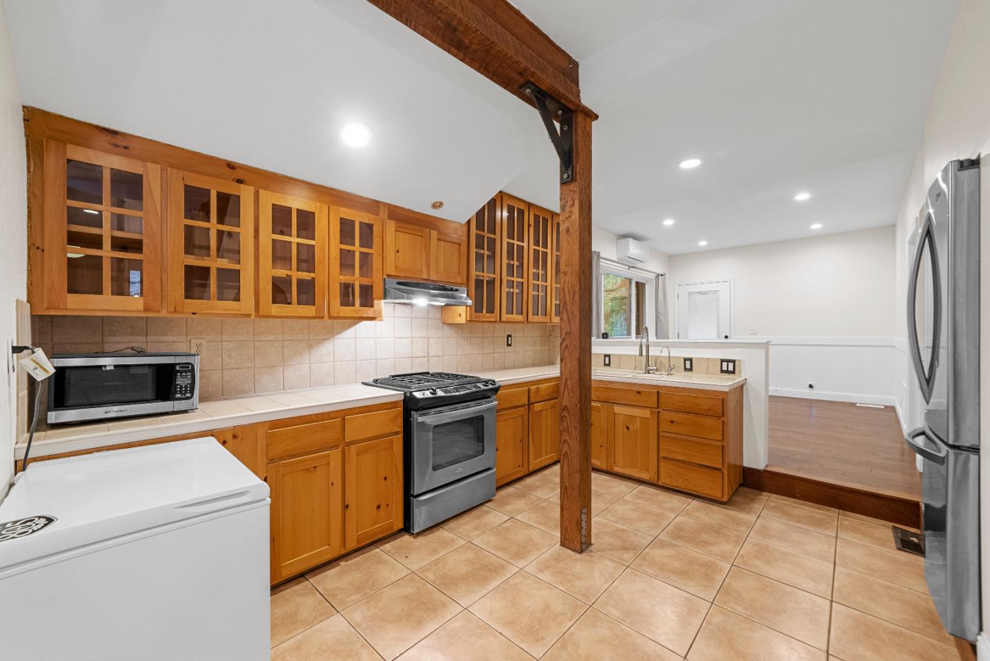 Undisclosed Address Boulder Creek, CA 95006 - Photo 14 of 41 a kitchen with stainless steel appliances granite countertop a stove and a sink