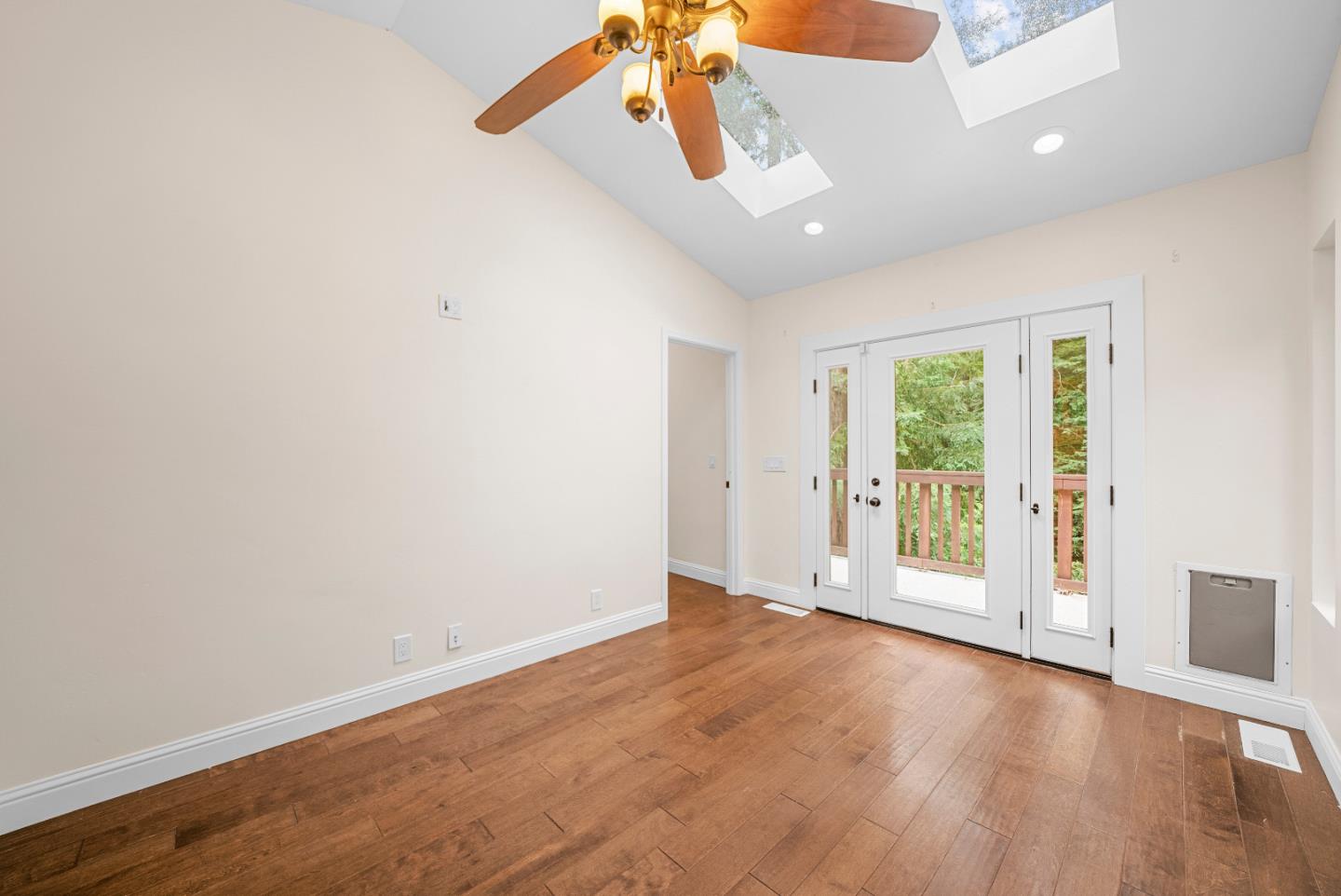 Undisclosed Address Boulder Creek, CA 95006 - Photo 20 of 41 an empty room with wooden floor and windows