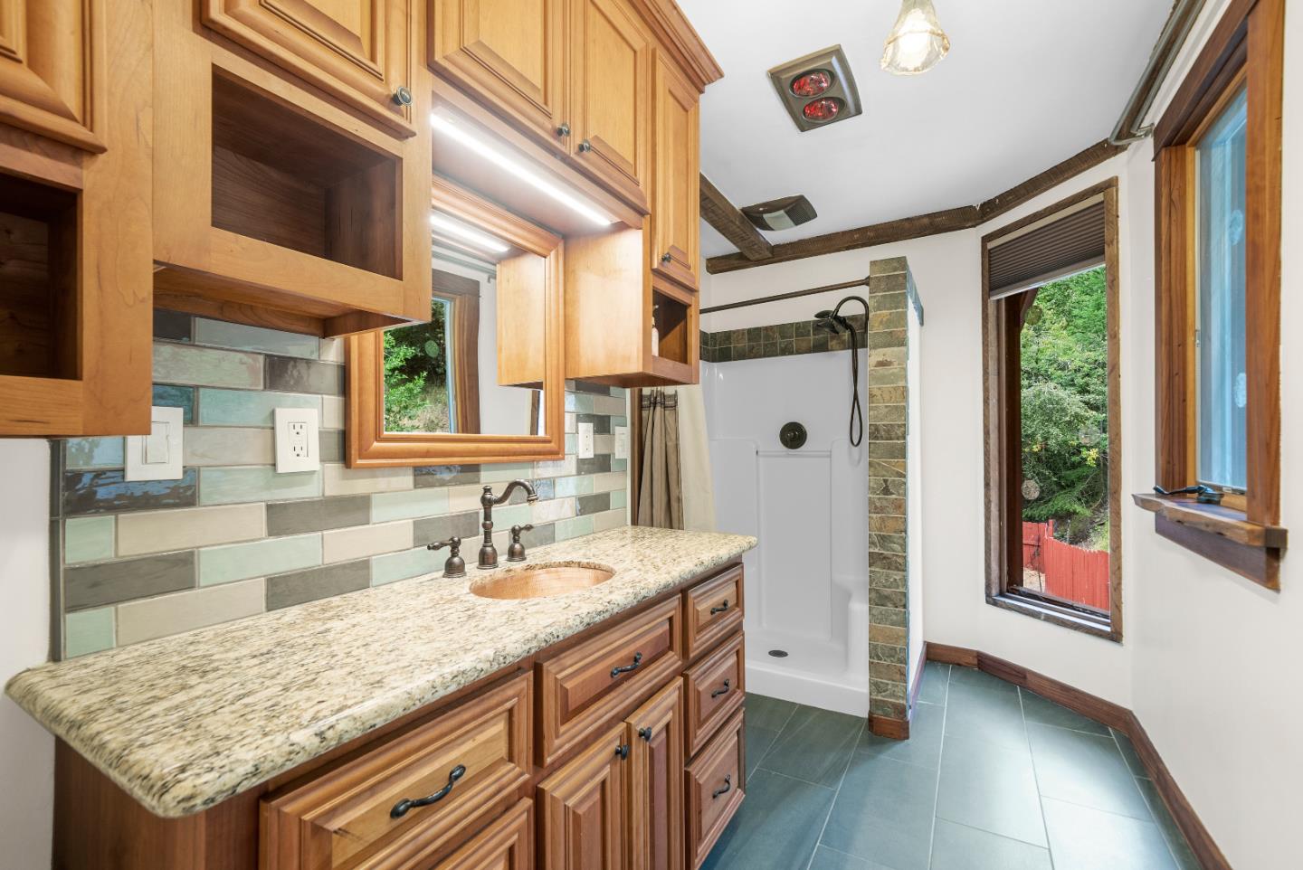 Undisclosed Address Boulder Creek, CA 95006 - Photo 22 of 41 a bathroom with a granite countertop sink and a mirror