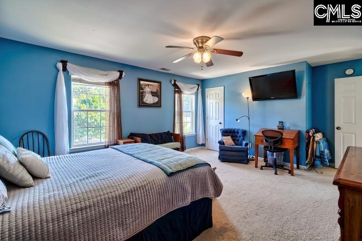 209 Eagle Pointe Drive Chapin, SC 29036 - Photo 31 of 40 a bedroom with a bed and furniture