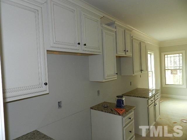 430 Fieldtrial Circle Garner, NC 27529 - Photo 5 of 23 a room with cabinets and a sink