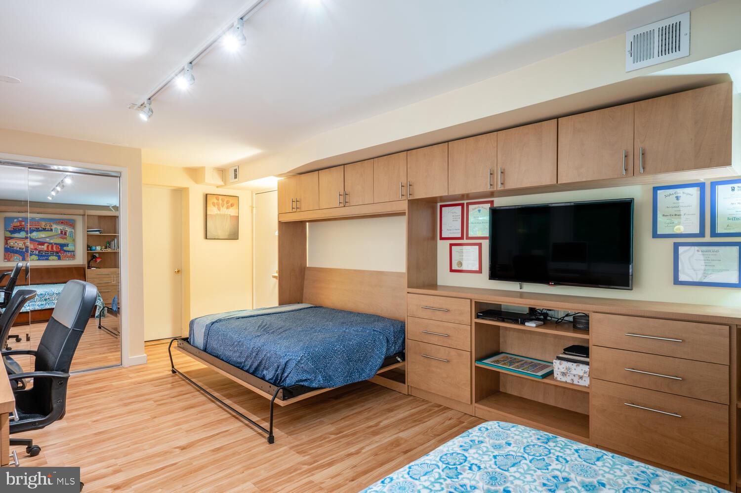 8313 Still Spring Court Bethesda, MD 20817 - Photo 26 of 39 4th bedroom with two Murphy Beds