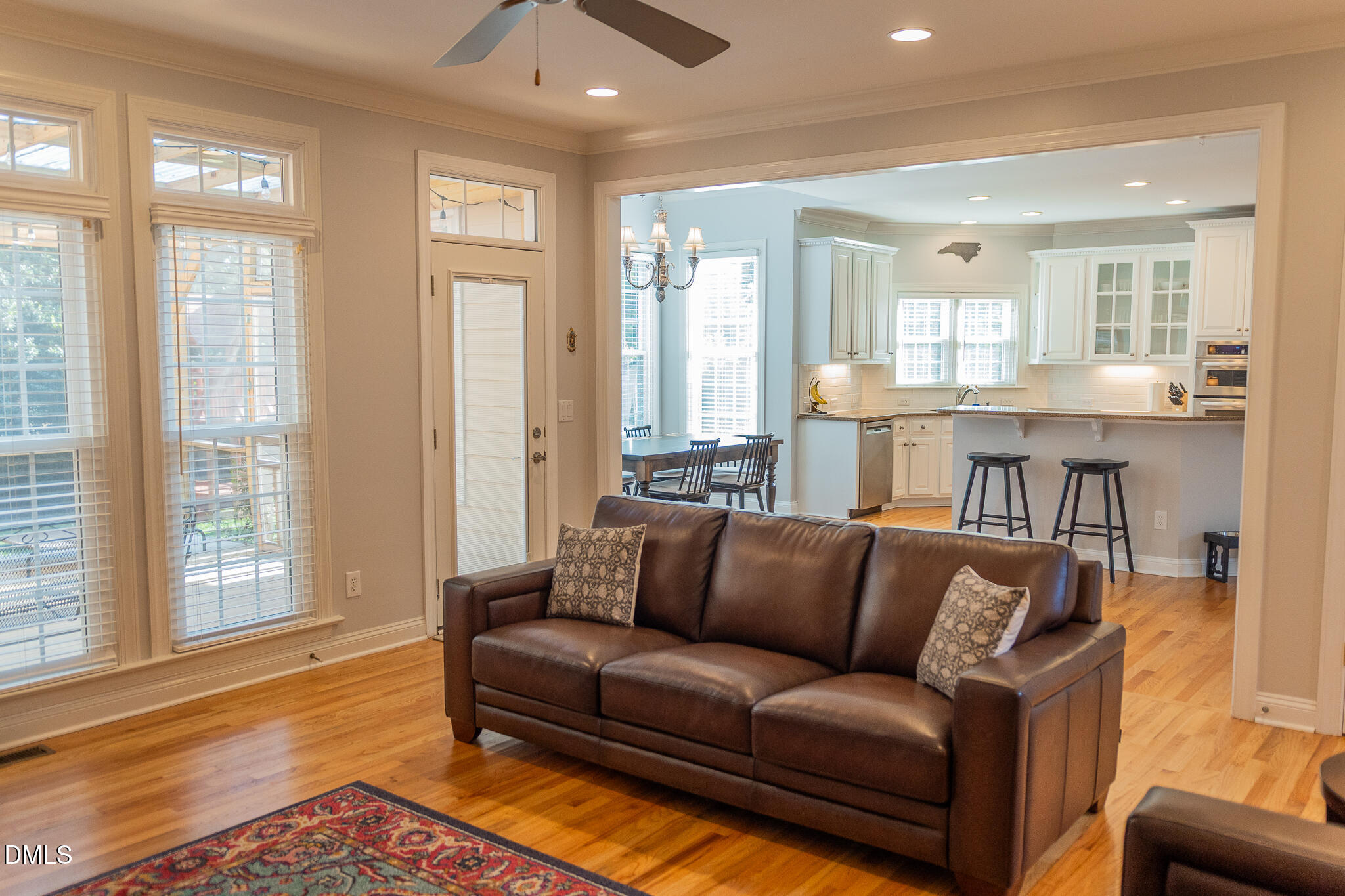 12324 Canolder Street Raleigh, NC 27614 - Photo 15 of 64 a living room with furniture and wooden floor