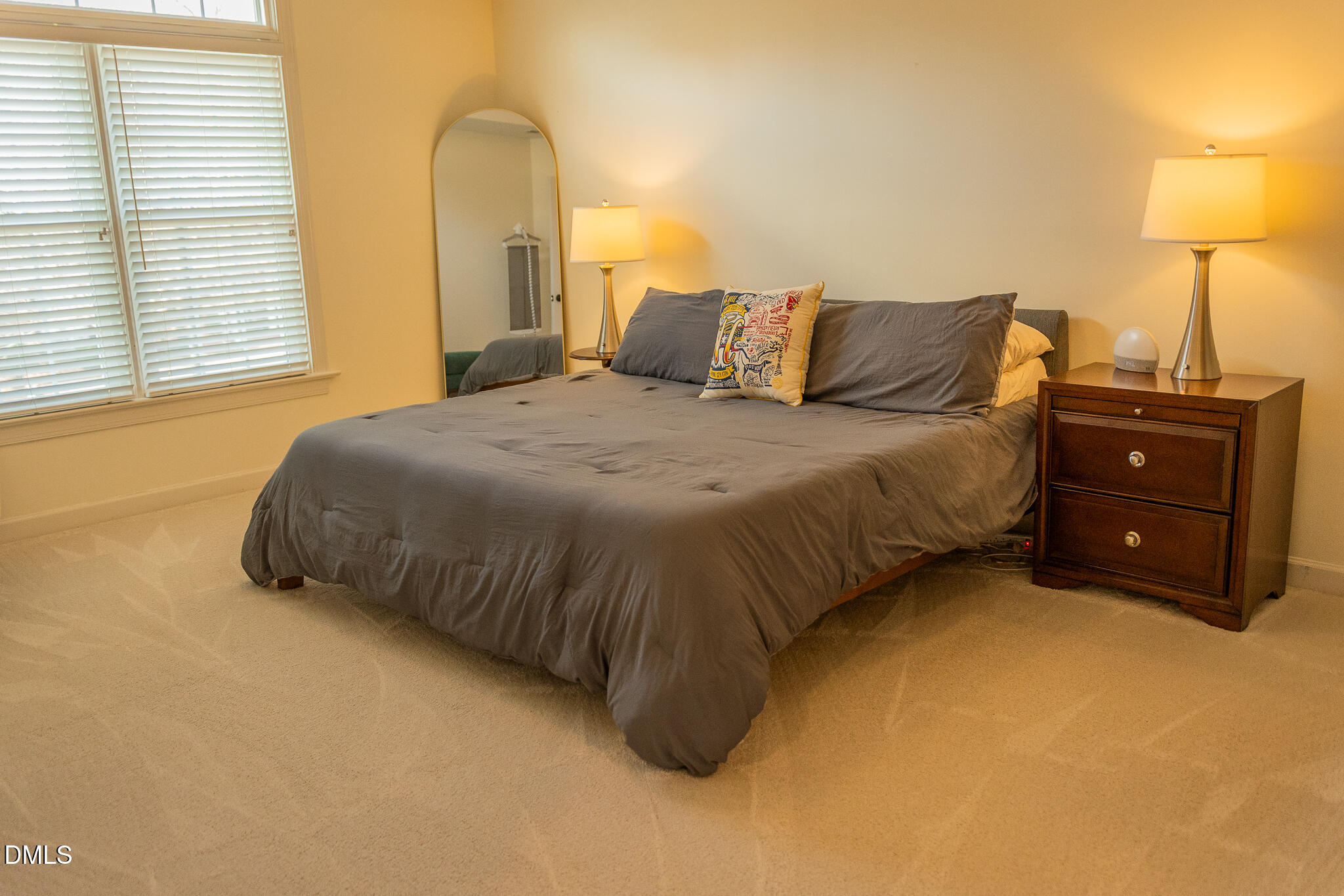 12324 Canolder Street Raleigh, NC 27614 - Photo 23 of 64 a bedroom with a bed and a lamp