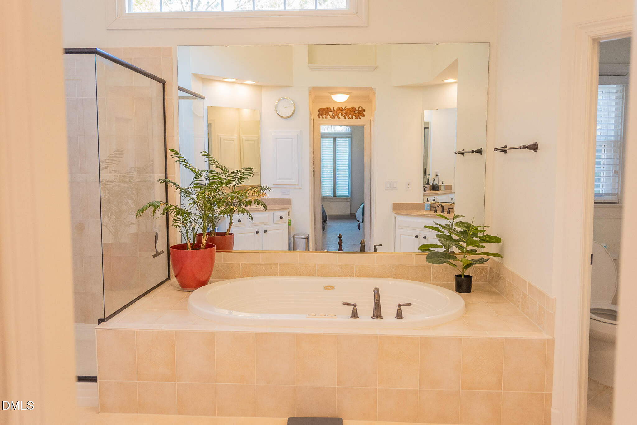 12324 Canolder Street Raleigh, NC 27614 - Photo 24 of 64 a white bath tub sitting in a bathroom