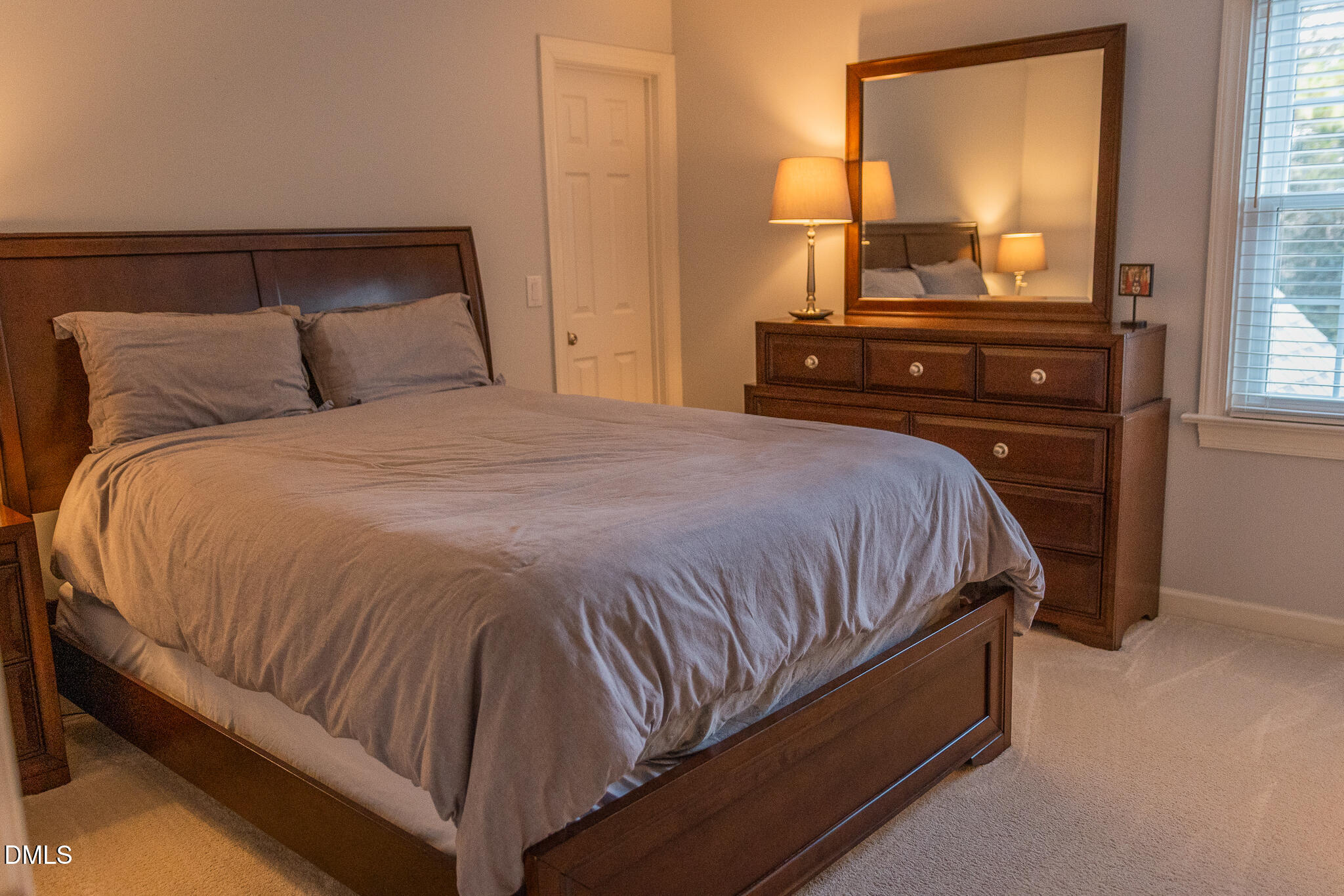 12324 Canolder Street Raleigh, NC 27614 - Photo 29 of 64 a bed sitting in a bedroom next to a window