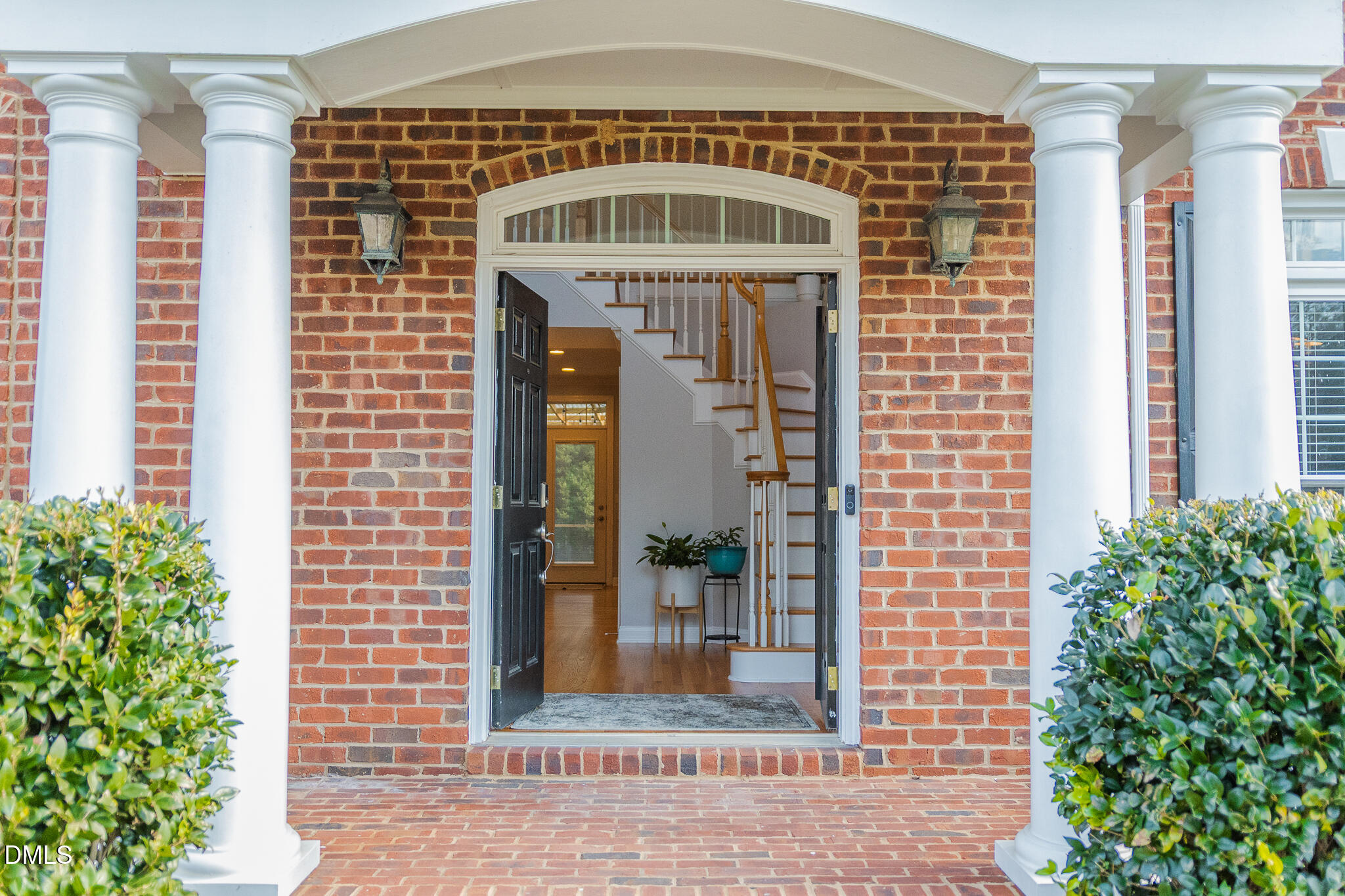 12324 Canolder Street Raleigh, NC 27614 - Photo 4 of 64 a front view of a building with a garden
