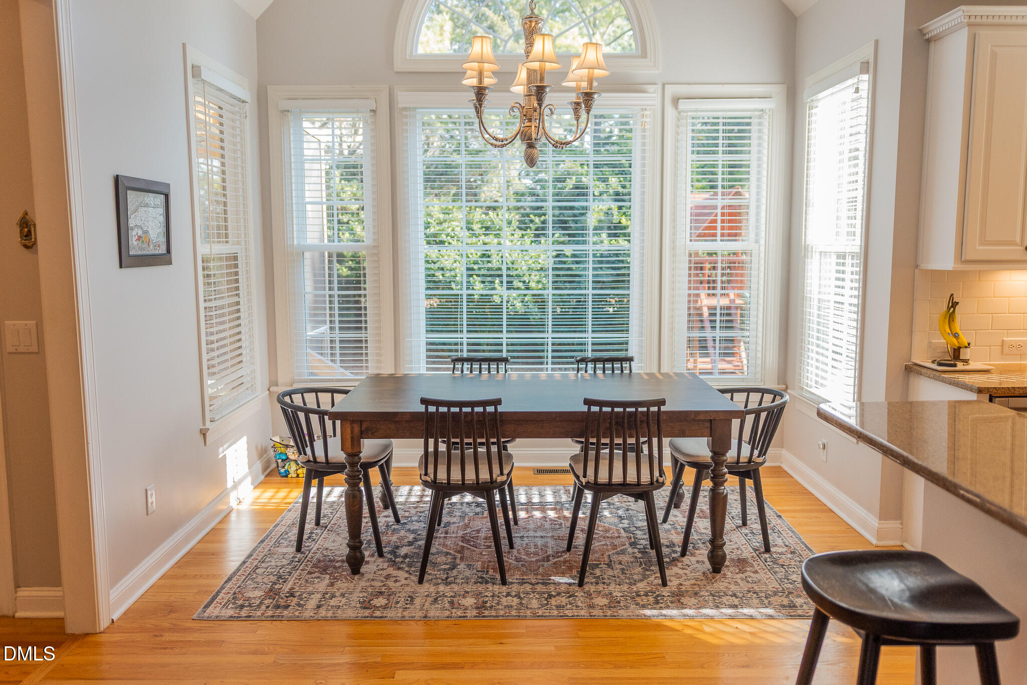 12324 Canolder Street Raleigh, NC 27614 - Photo 8 of 64 a dining room with furniture a chandelier and wooden floor