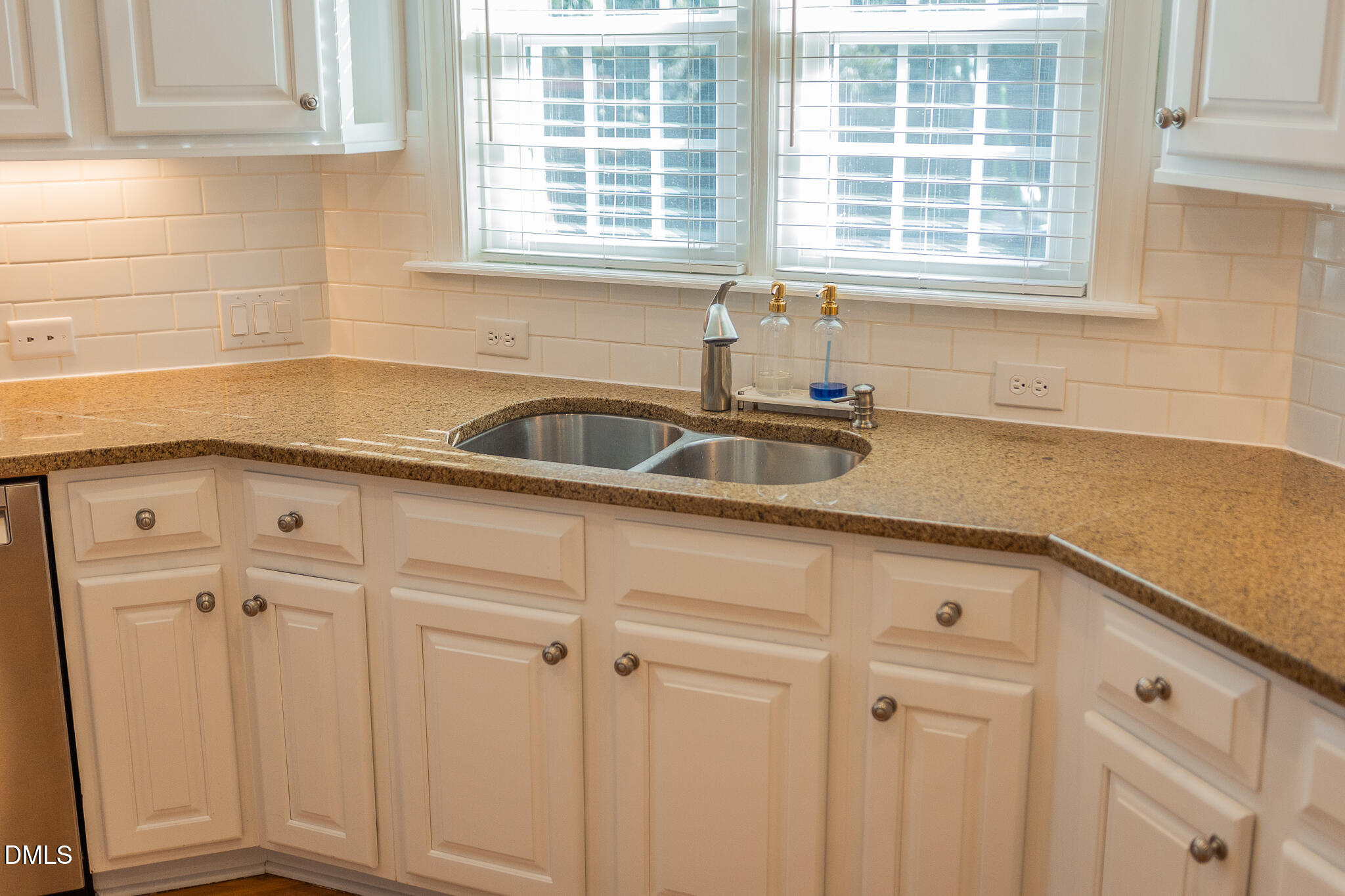 12324 Canolder Street Raleigh, NC 27614 - Photo 9 of 64 a kitchen with stainless steel appliances white cabinets and a sink