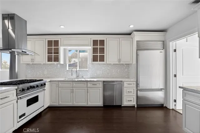 a bathroom with a granite countertop sink a toilet and a mirror