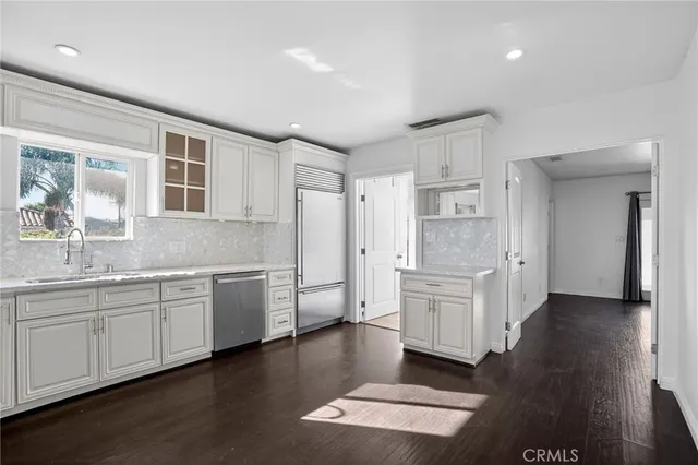 a bathroom with a tub shower sink and vanity