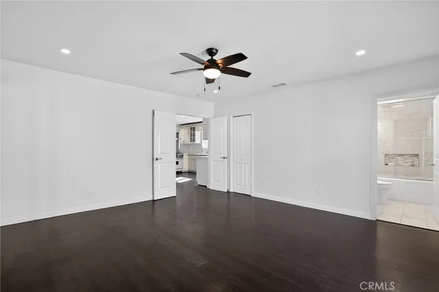 an aerial view of a house with a garden and lake view