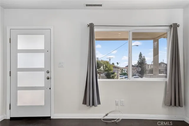 a kitchen with stainless steel appliances a stove a sink and a refrigerator